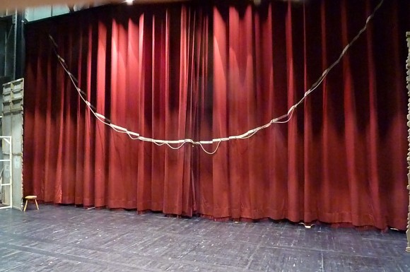 A tableau curtain from behind the stage